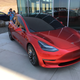 Tesla tries to turn its customers into true believers. One of its strategies is inviting car owners to its product launch parties, one of which will happen this Friday as more than 2,000 Tesla owners and their guests descend on the Gigafactory. The team rolled out a Model 3 demo model, although the car appears to be for demonstration only. Workers push the car back across the parking lot manually.